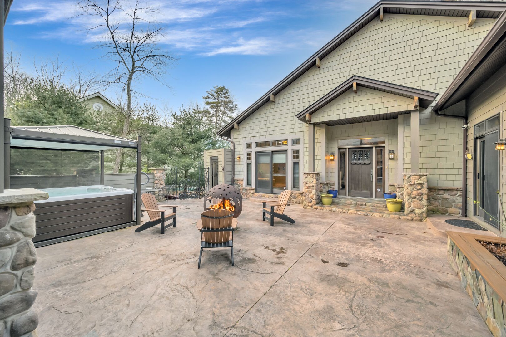 backyard with firepit and hot tub