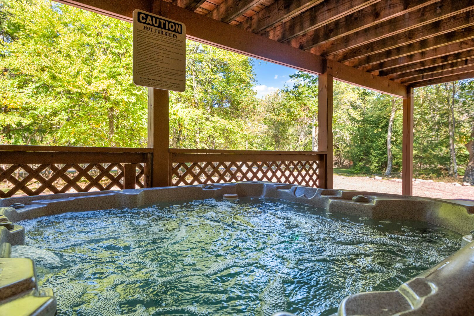 outdoor hot tub under balcony