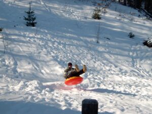 Snow tubing is a popular activity during winter fun in the Poconos