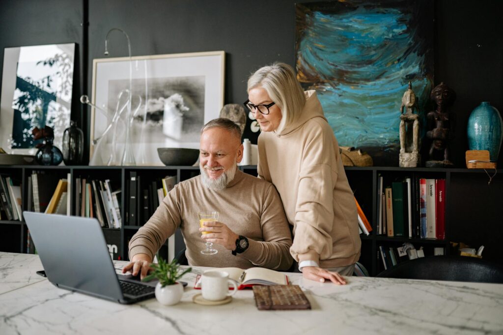 A couple viewing a laptop